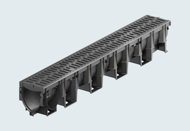 ACO DRAIN® XtraDrain 3D-Rendering einer Linienentwässerungsrinne aus Kunststoff mit Compositrost mit Microgrip, Hexagonalstruktur der Seitenwand.