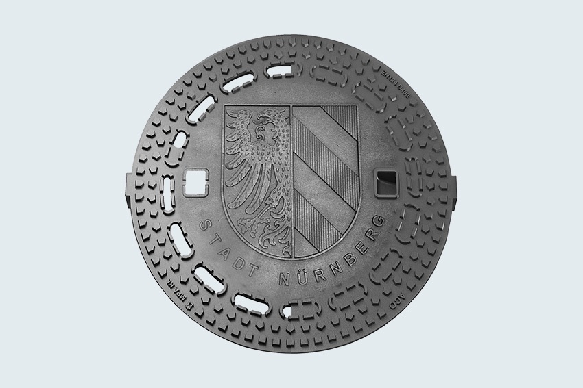 3D-Rendering einer runden Schachtabdeckung mit dem Wappen der Stadt Nürnberg.