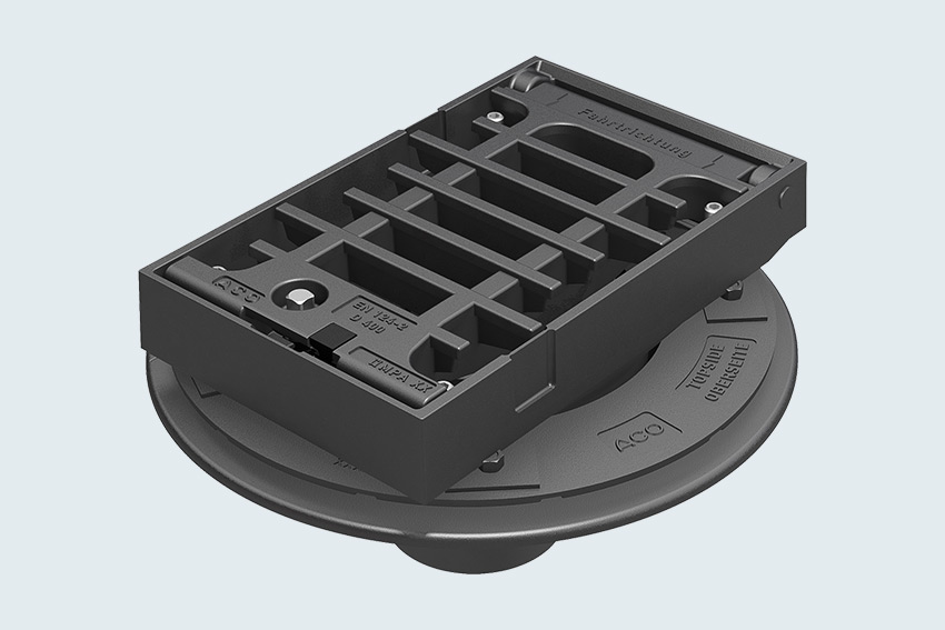 3D-Rendering eines runden Entwässerungsdeckels mit rechteckigem Gitterrost.